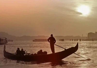 Romantic gondola ride at sunset of the day