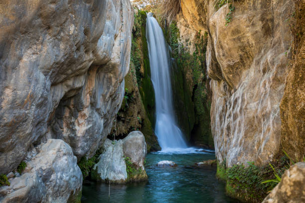 Scenic view of the main waterfall of Fuentes del Algar in Callosa d'En Sarria, Alicante, Spain